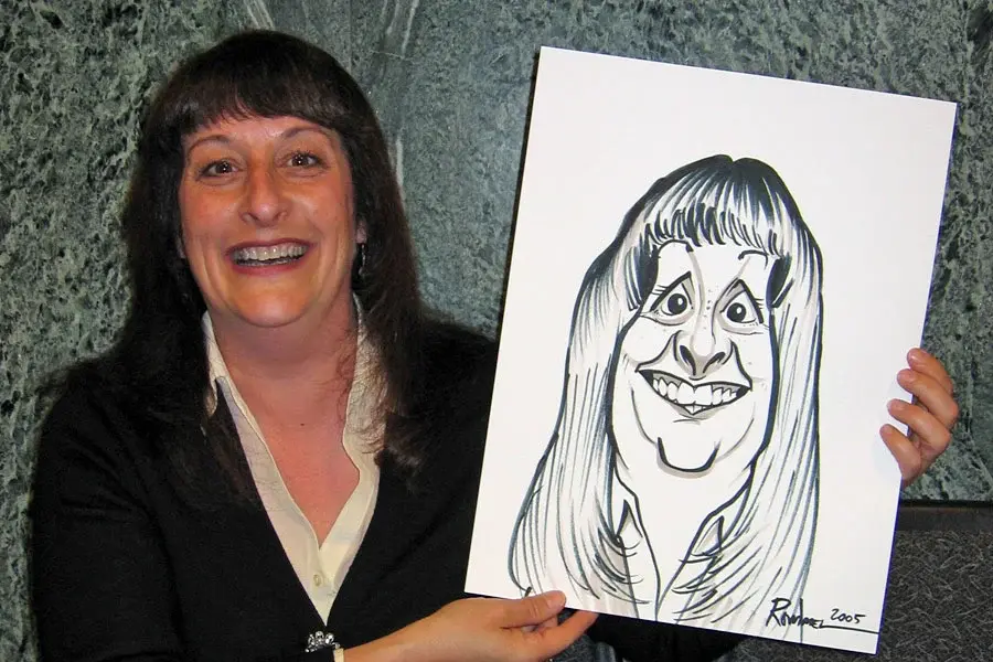 Woman Holding Her Caricature At An Event